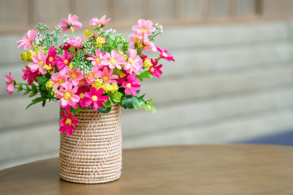 a flower basket on the table
