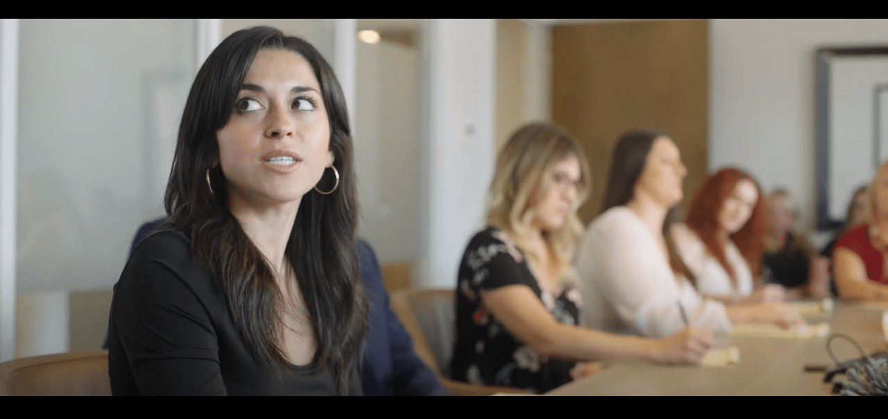 women in a room taking notes and dicussing