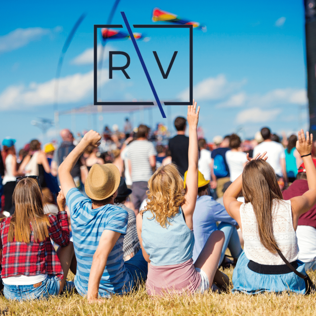 People at a music festival with Richmond Vona logo in the sky