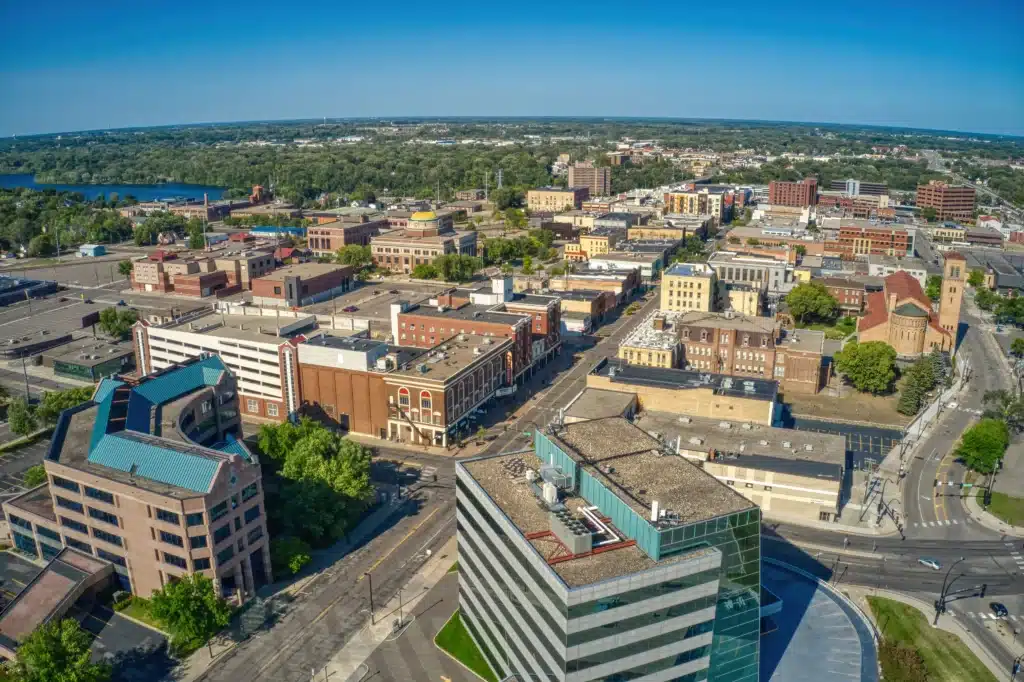 Aerial view of a mid-sized city with modern and historic buildings