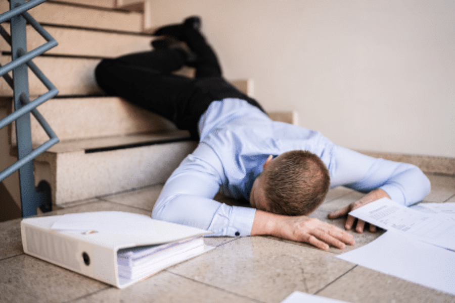 Man slipping and falling on stairs