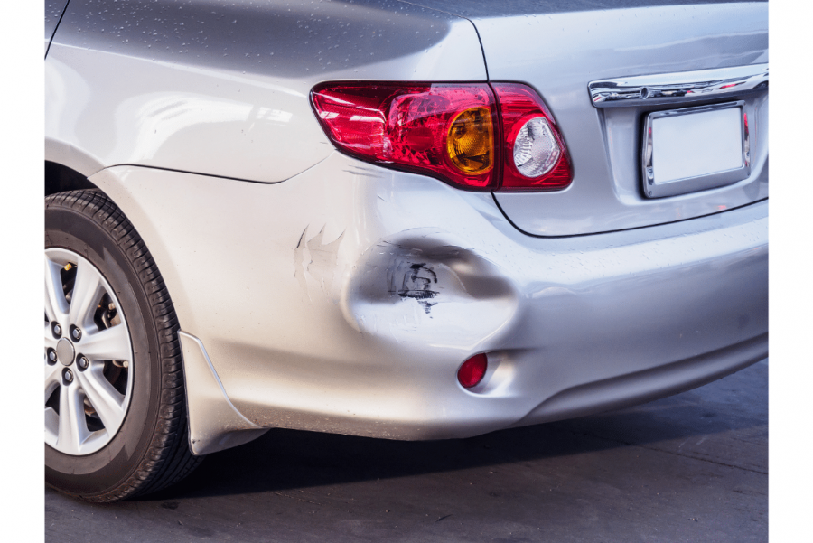 car with dented rear fender